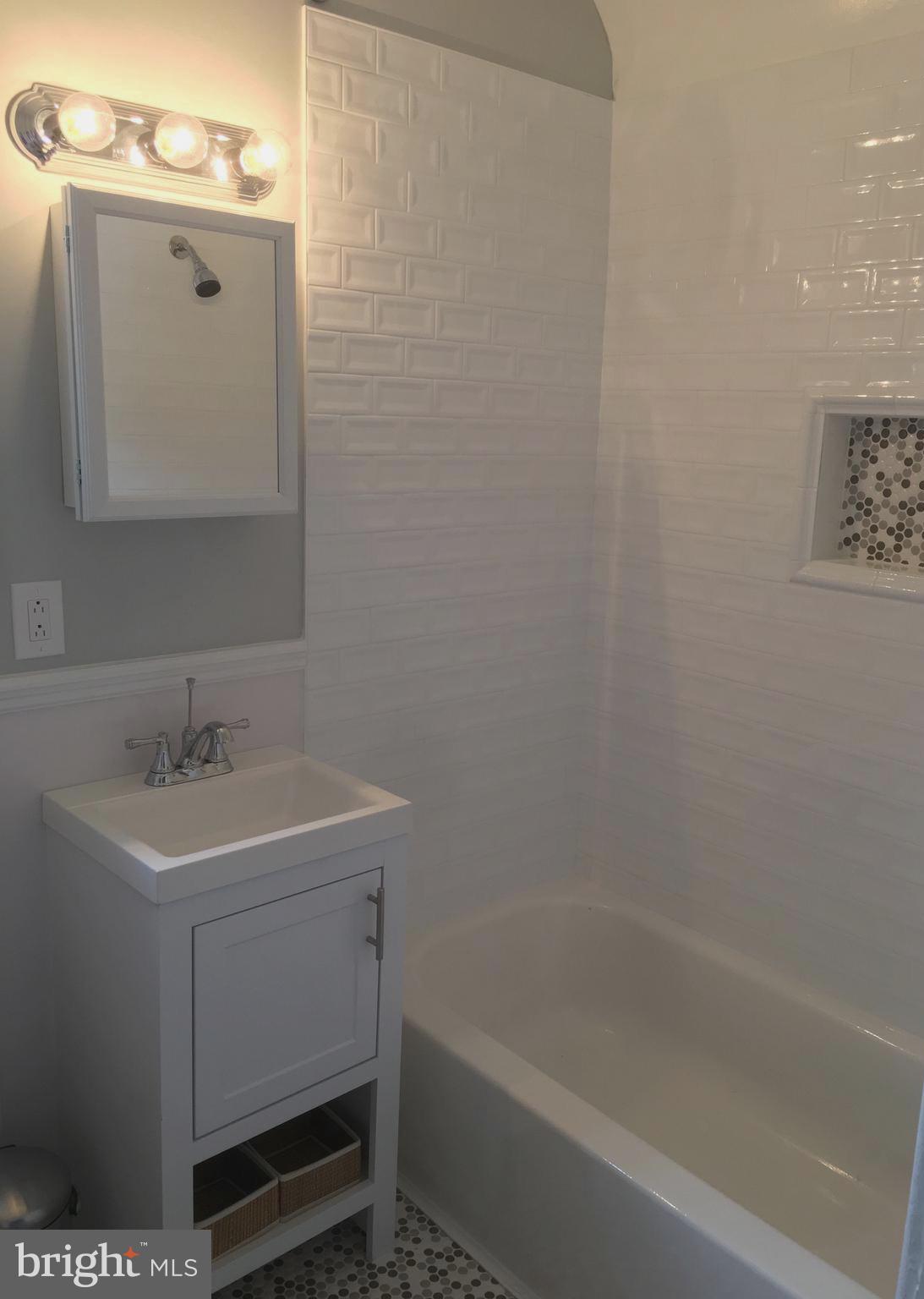 813 Cedarcroft Road Baltimore, MD 21212 - Photo 26 of 43 White tile tub surround is beautiful!
