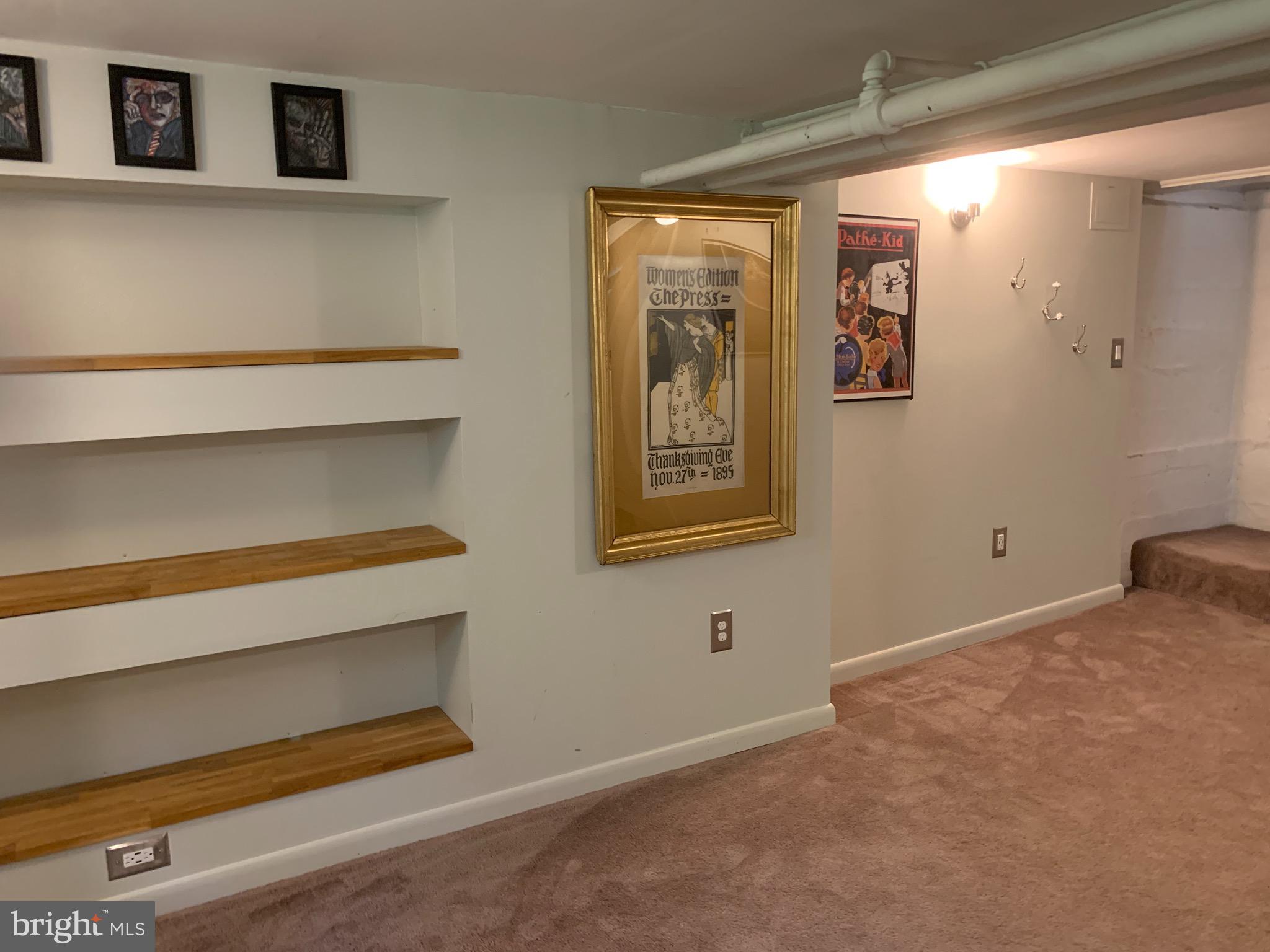 813 Cedarcroft Road Baltimore, MD 21212 - Photo 31 of 43 Lower level family room with carpeting + built ins