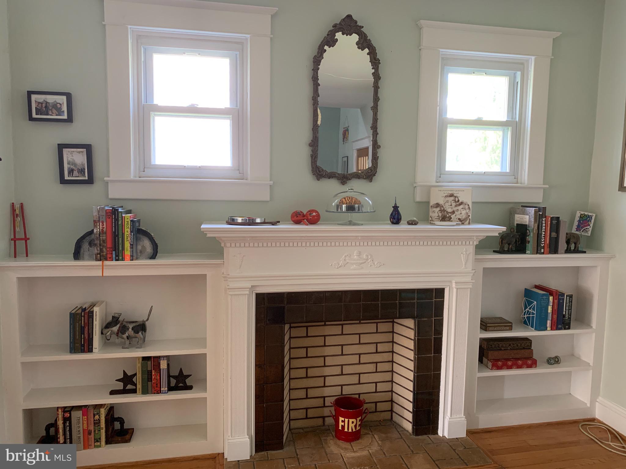 813 Cedarcroft Road Baltimore, MD 21212 - Photo 6 of 43 Built-ins and windows flank the faux fireplace!