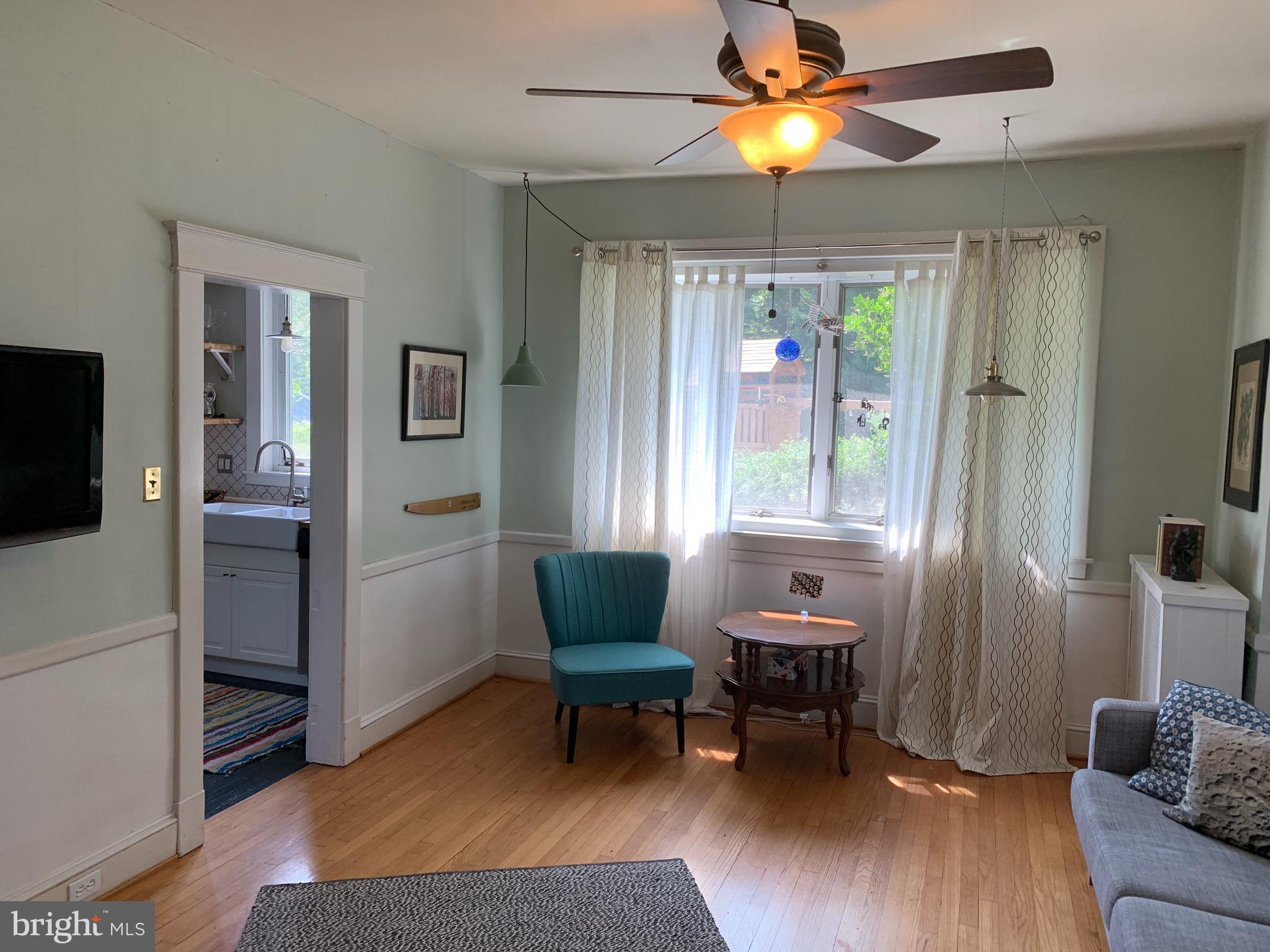 813 Cedarcroft Road Baltimore, MD 21212 - Photo 9 of 43 Ceiling fan, wood floors & a wall of windows!