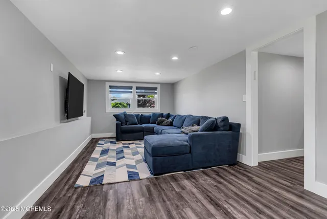 a living room with furniture and a rug