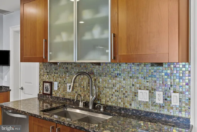 a close view of a sink and a mirror