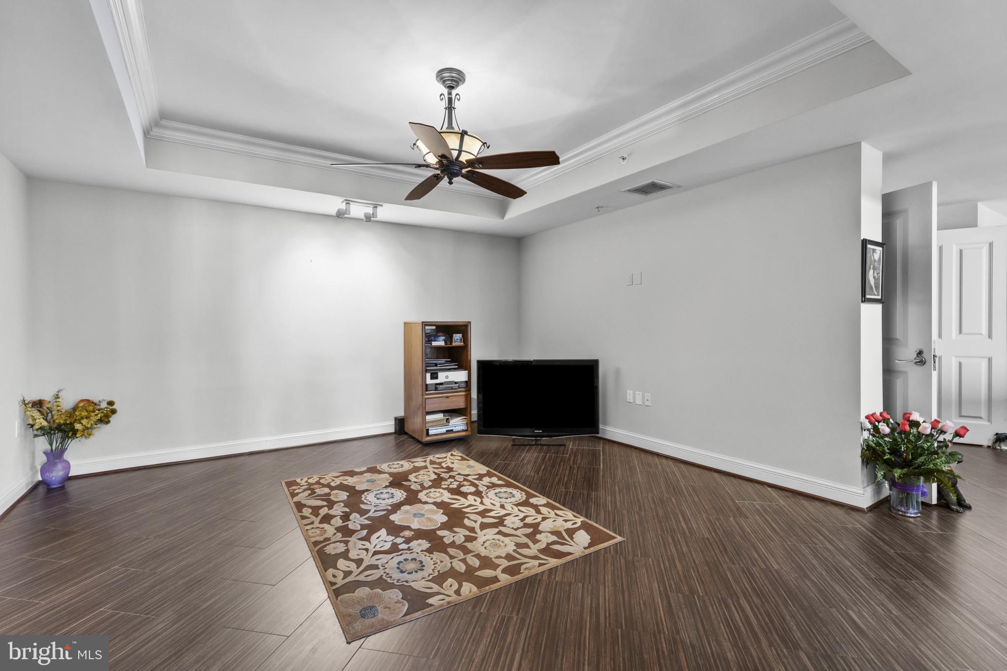 801 Key Highway, Unit 251 Baltimore, MD 21230 - Photo 16 of 57 a view of workspace with wooden floor and ceiling fan