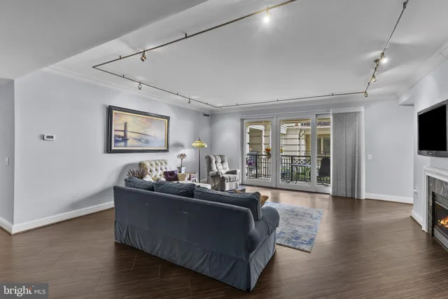 a living room with furniture and a fireplace or television