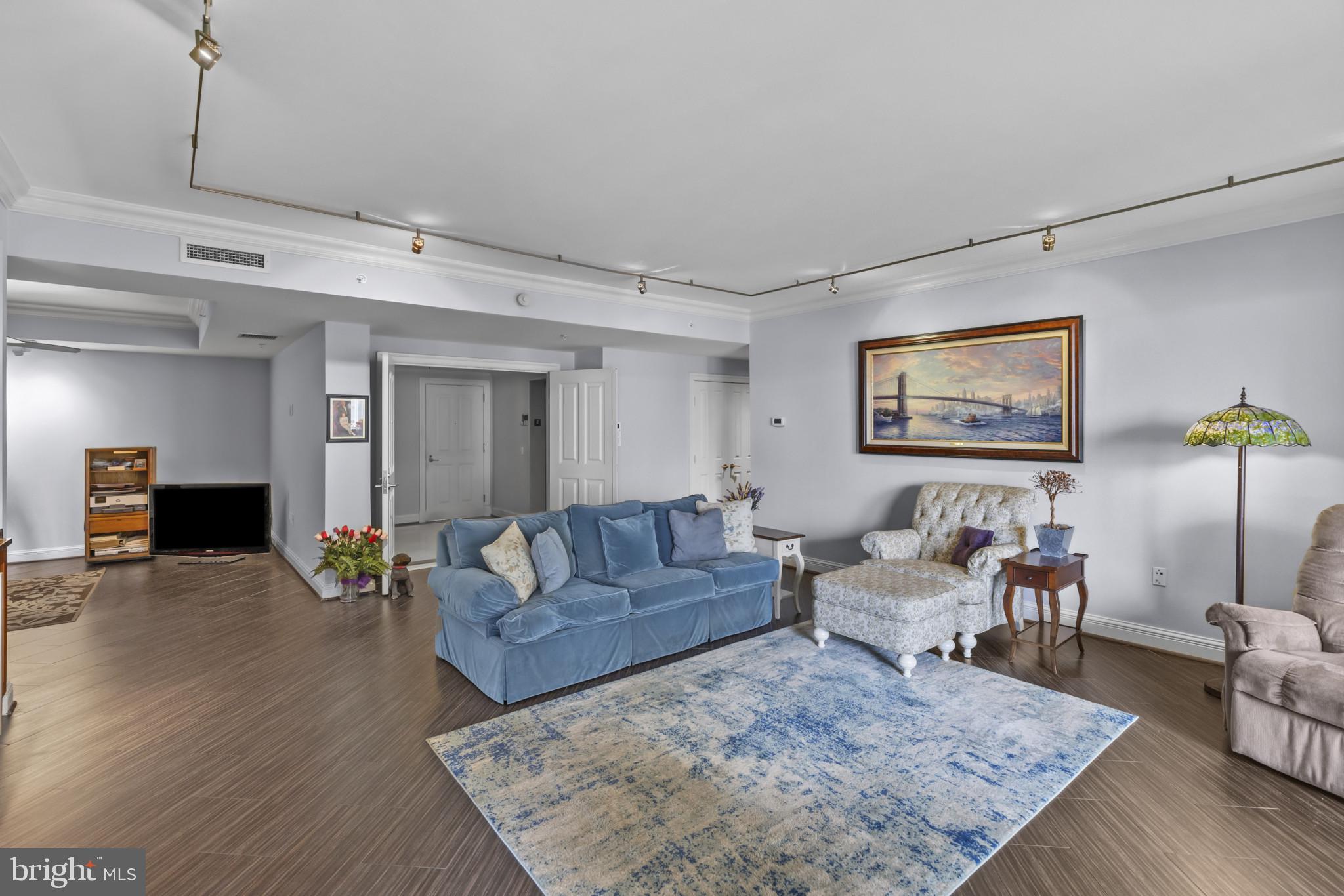 801 Key Highway, Unit 251 Baltimore, MD 21230 - Photo 22 of 57 a living room with furniture and wooden floor