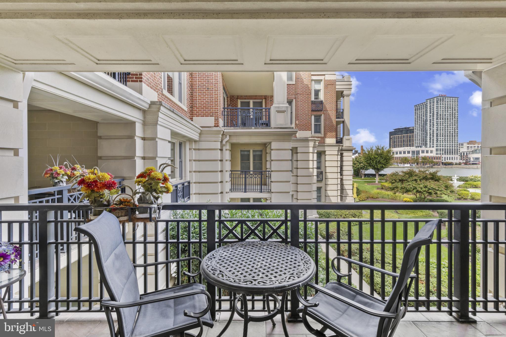 801 Key Highway, Unit 251 Baltimore, MD 21230 - Photo 24 of 57 a view of a balcony with chairs