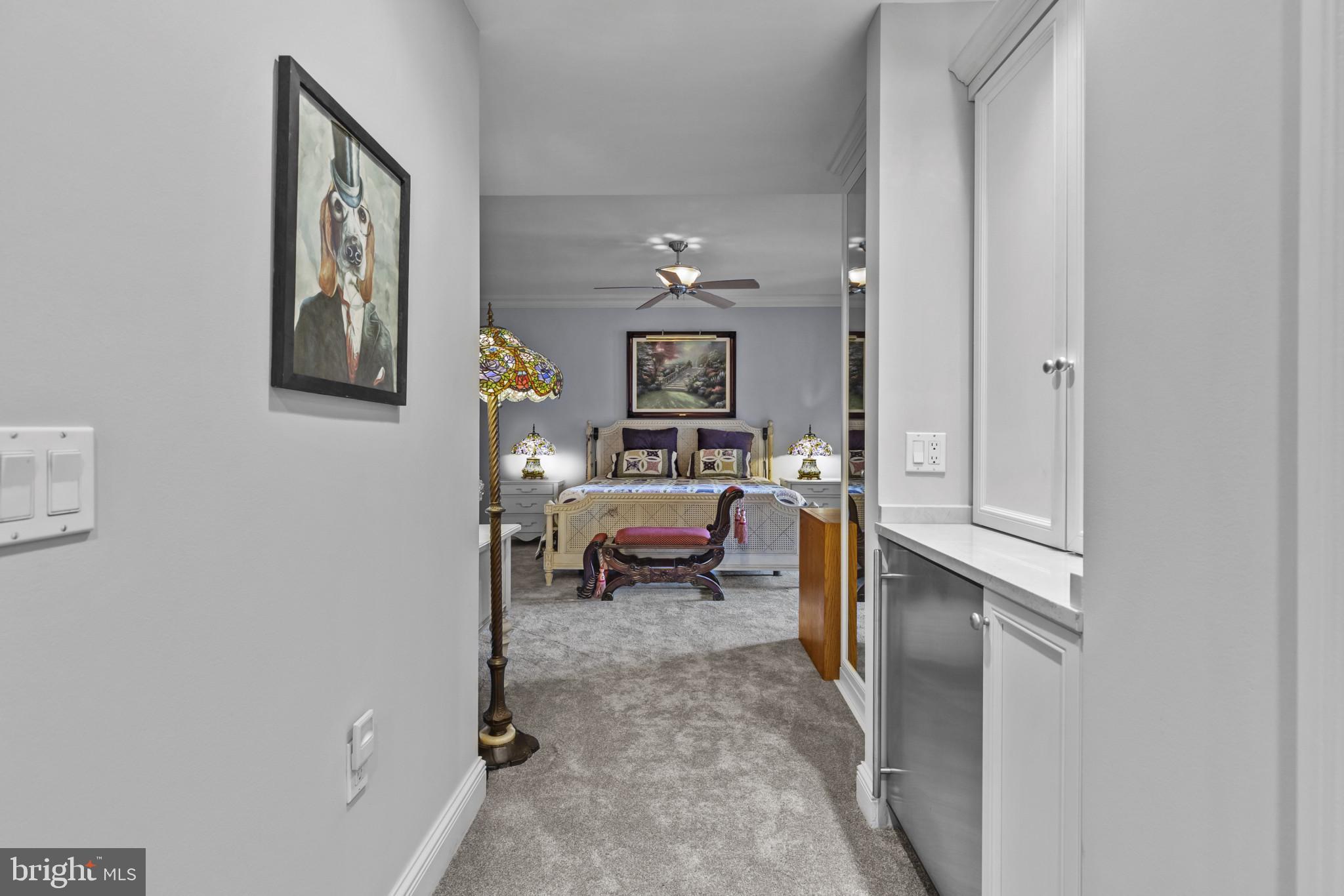 801 Key Highway, Unit 251 Baltimore, MD 21230 - Photo 28 of 57 a bedroom with a bed and a view of en suite bathroom