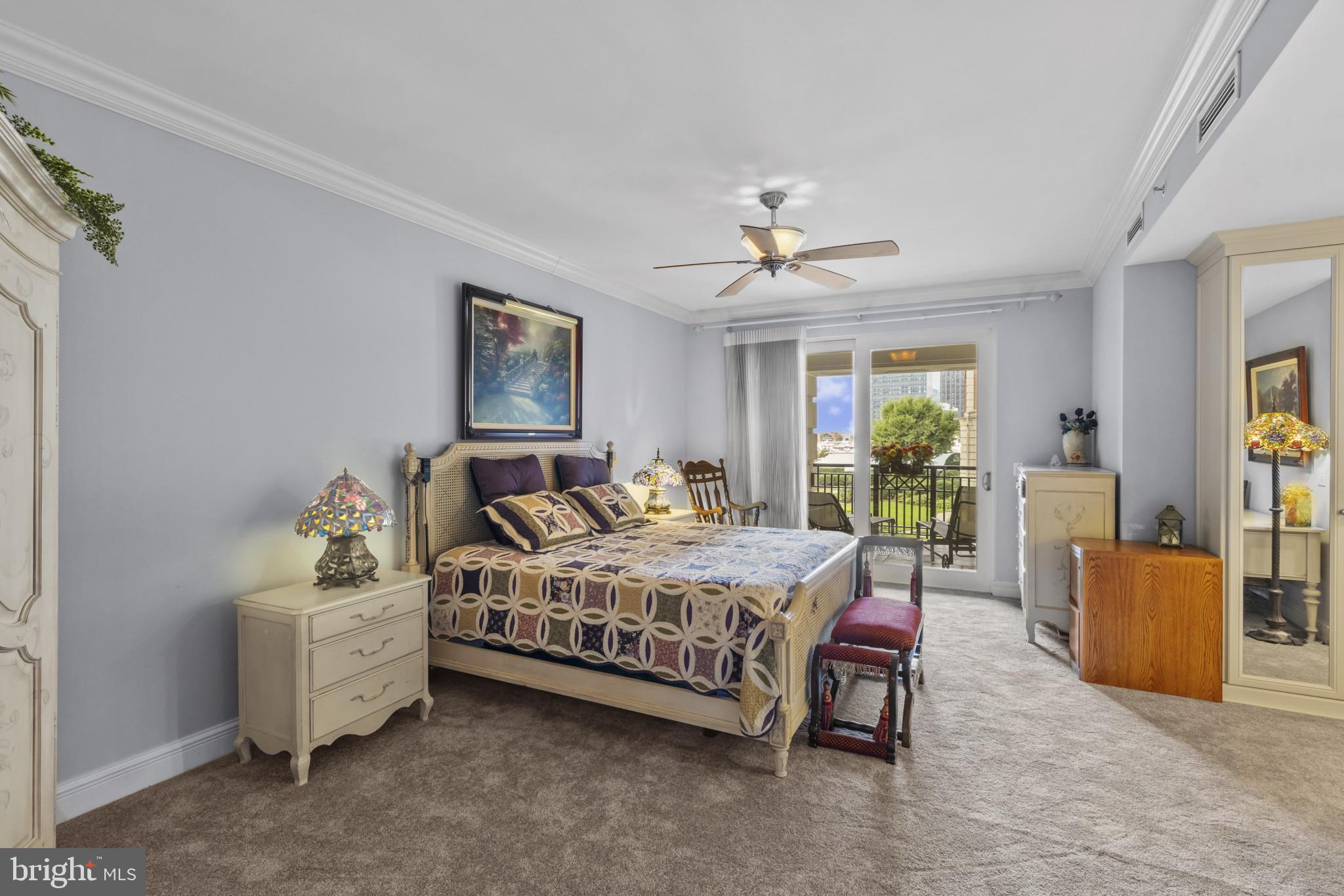 801 Key Highway, Unit 251 Baltimore, MD 21230 - Photo 29 of 57 a bedroom with a bed and furniture