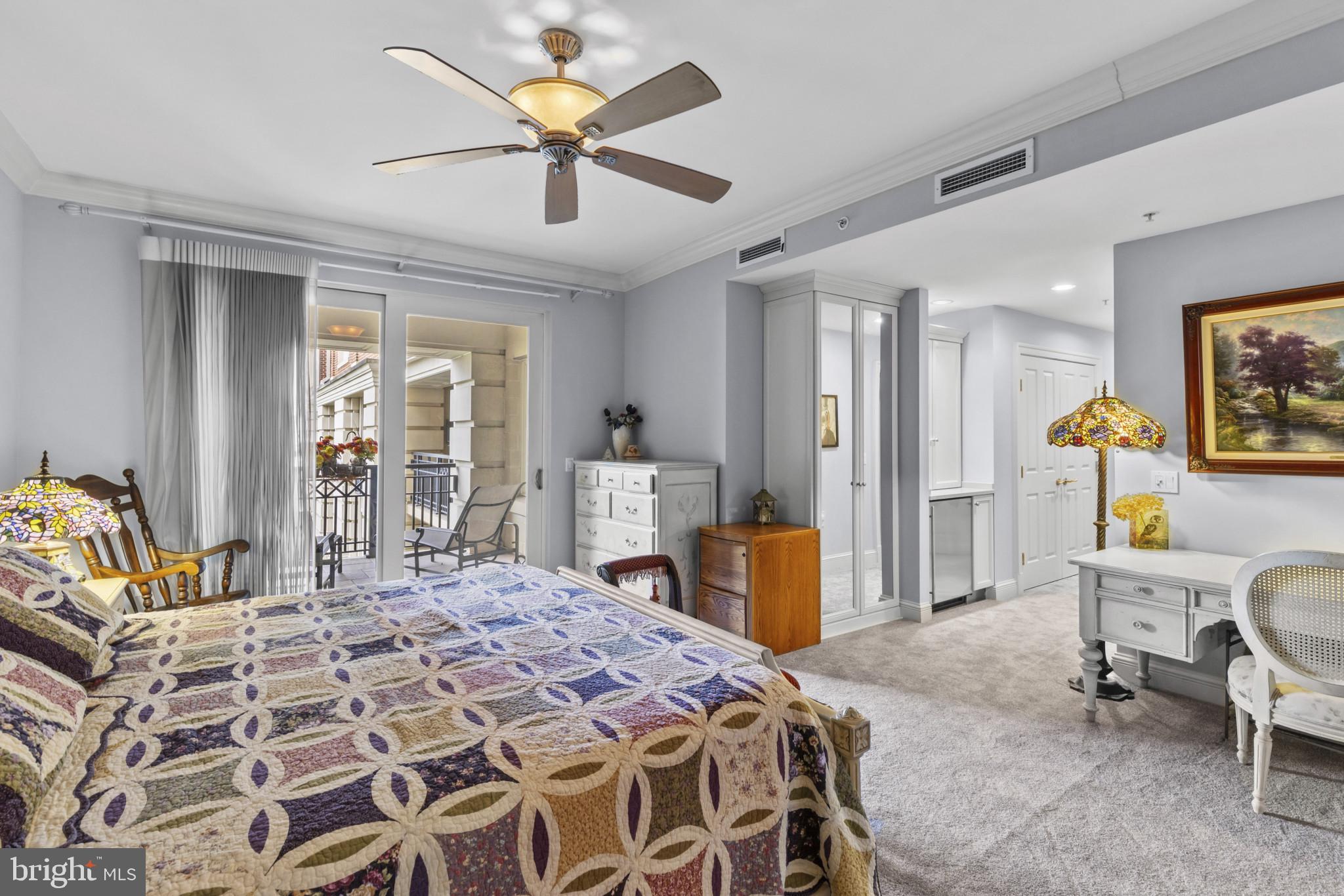 801 Key Highway, Unit 251 Baltimore, MD 21230 - Photo 30 of 57 a bedroom with a bed and a chandelier