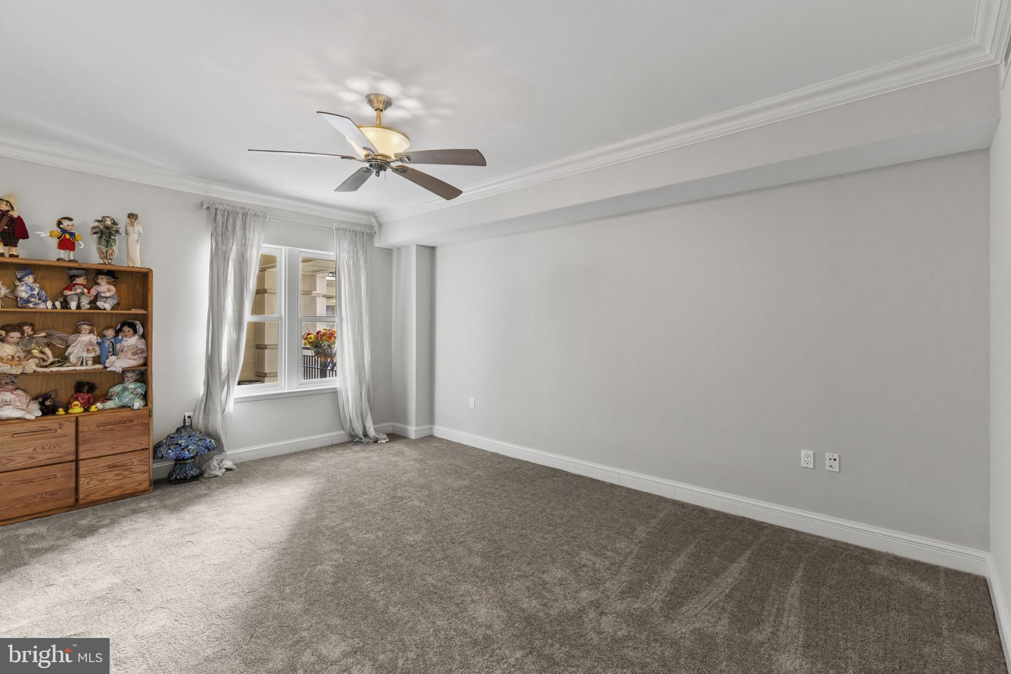 801 Key Highway, Unit 251 Baltimore, MD 21230 - Photo 36 of 57 a view of a room with workspace and a ceiling fan