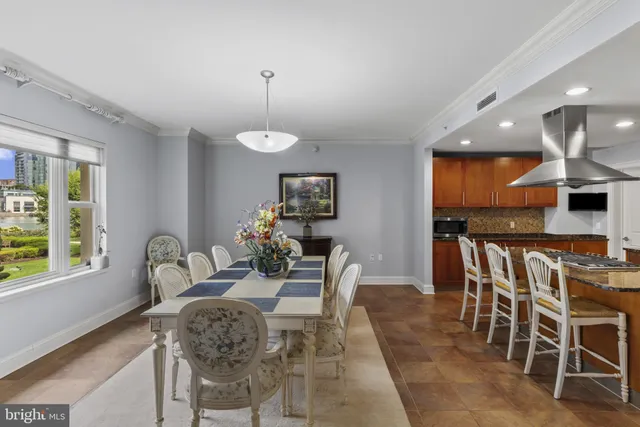 a dining room with furniture and window