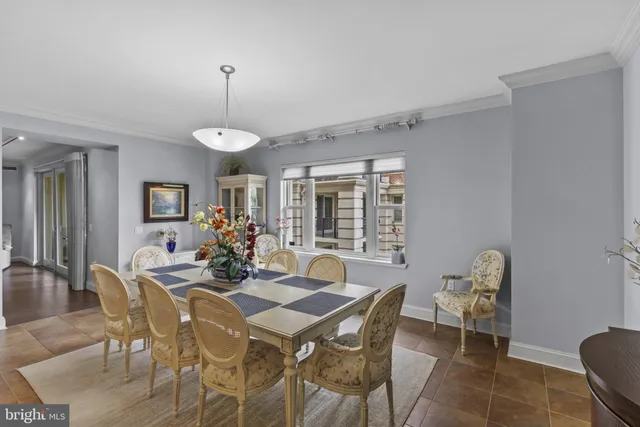 a view of a dining room with furniture and window