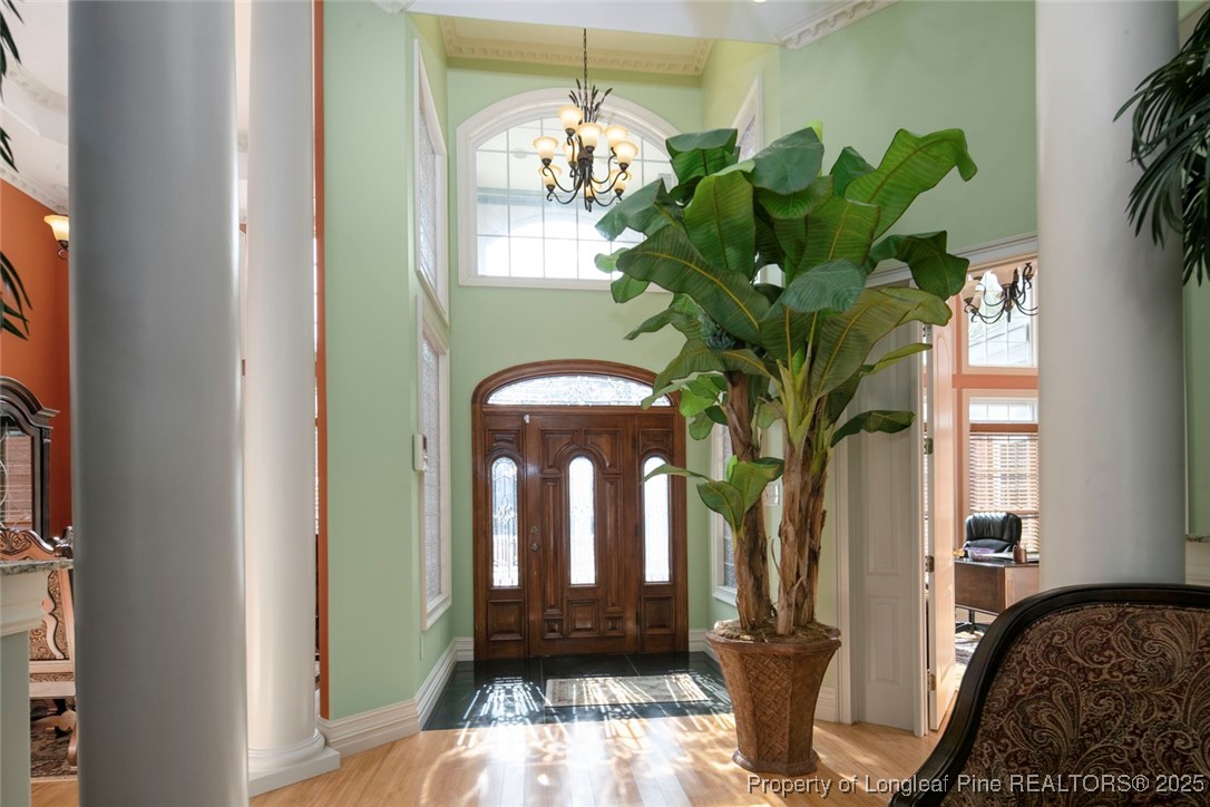 5304 Pineview Road Lumberton, NC 28360 - Photo 18 of 49 a vase of flowers sitting on a floor in front of a door