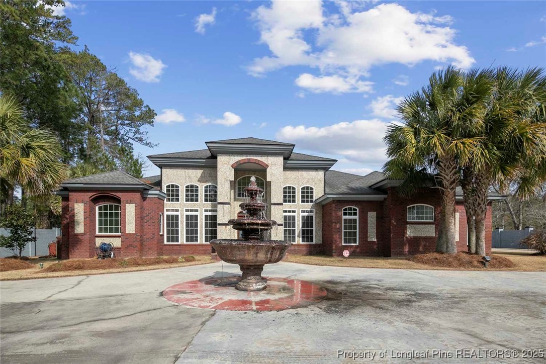 5304 Pineview Road Lumberton, NC 28360 - Photo 2 of 49 a front view of a house with a garden