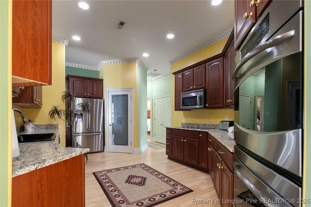 a kitchen with a sink and a stove