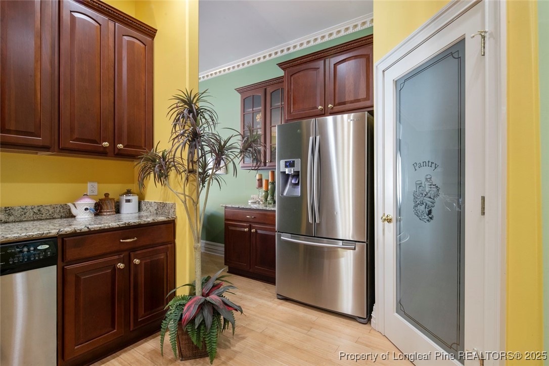 5304 Pineview Road Lumberton, NC 28360 - Photo 23 of 49 a kitchen with stainless steel appliances granite countertop a refrigerator and a sink