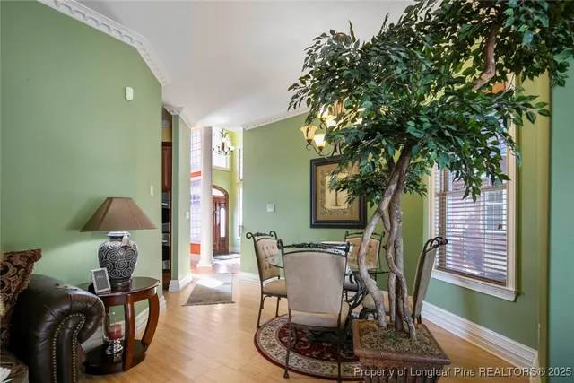 a living room with furniture and large windows