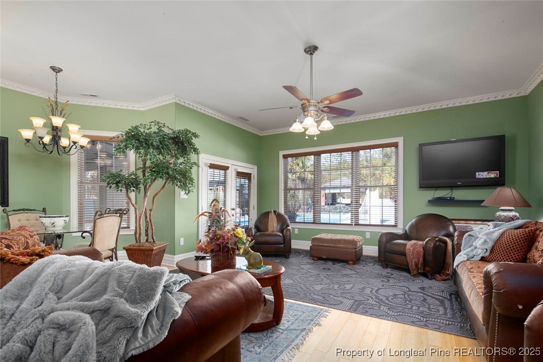 5304 Pineview Road Lumberton, NC 28360 - Photo 40 of 49 a living room with furniture and a chandelier