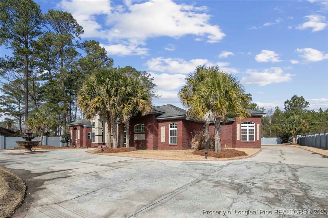 5304 Pineview Road Lumberton, NC 28360 - Photo 7 of 49 a front view of a house with a yard