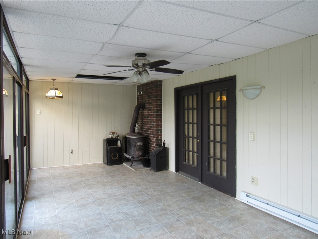 1120 Vincent Road Southeast North Canton, OH 44720 - Photo 47 of 50 Sun room with heating stove