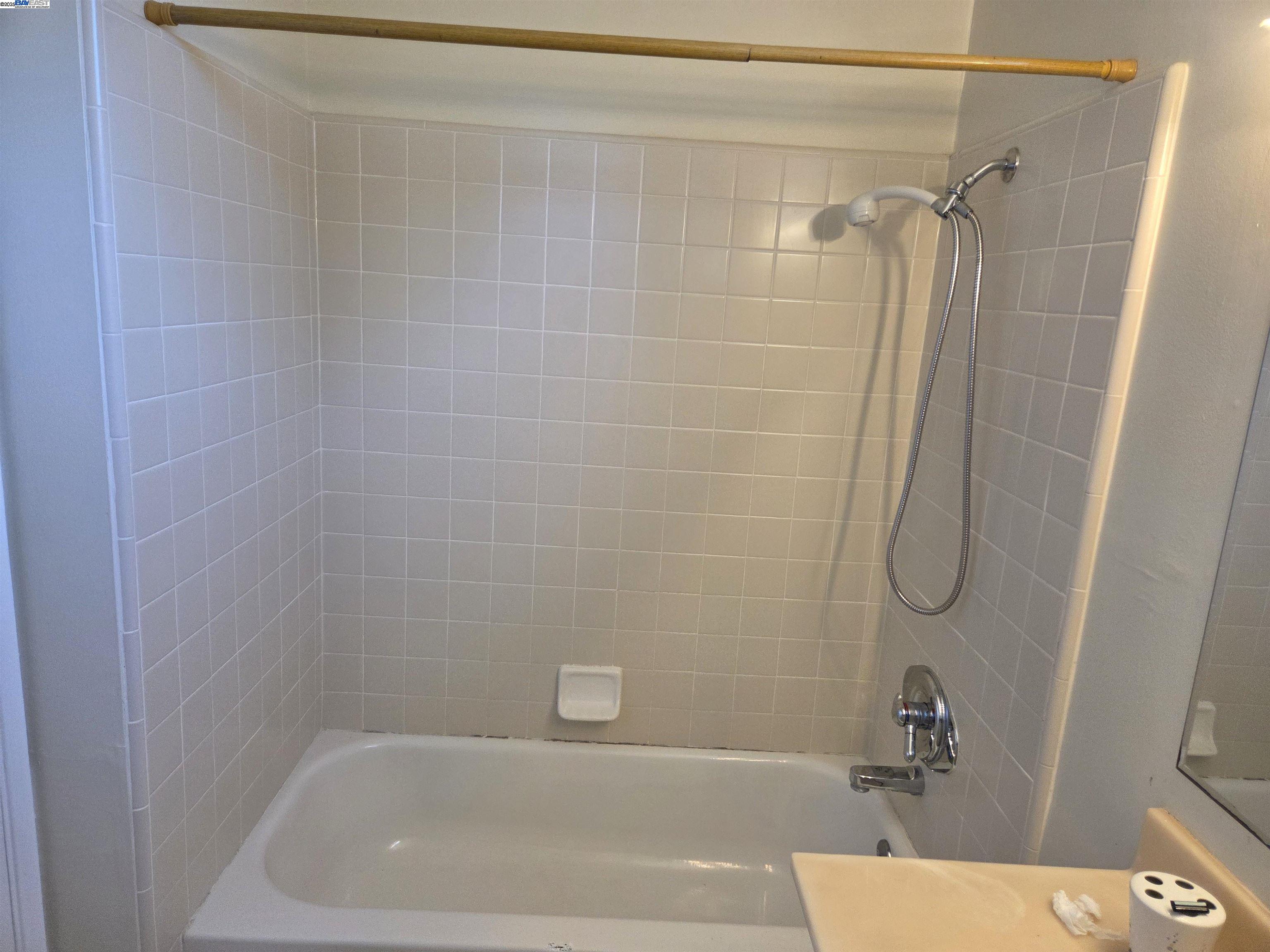 6198 Hancock Avenue San Jose, CA 95123 - Photo 15 of 27 a bathroom with a bath tub with a shower