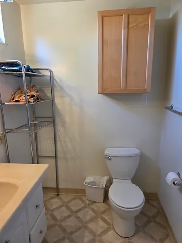 a bathroom with a toilet and a sink
