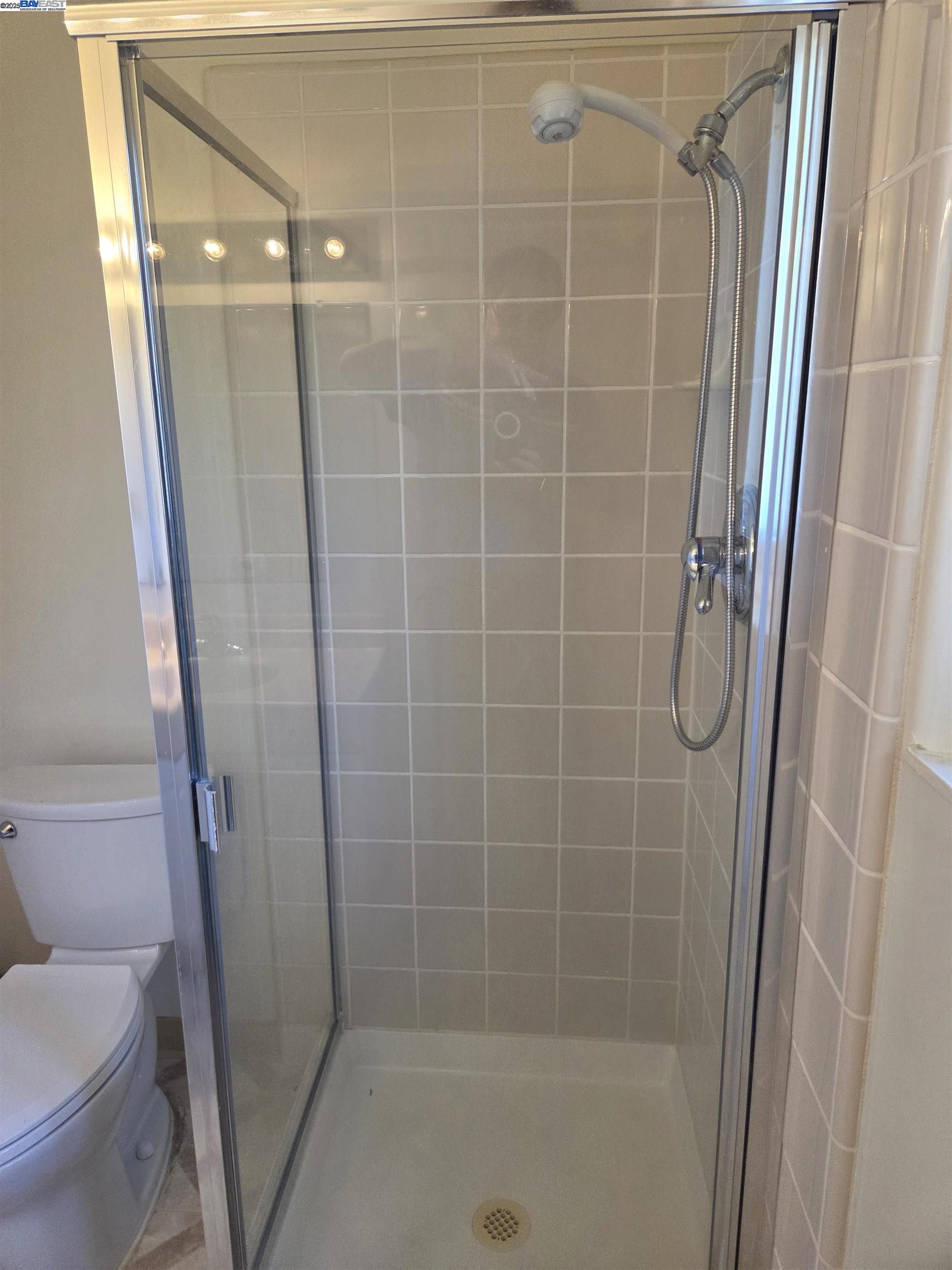 6198 Hancock Avenue San Jose, CA 95123 - Photo 20 of 27 a bathroom with a shower and a toilet