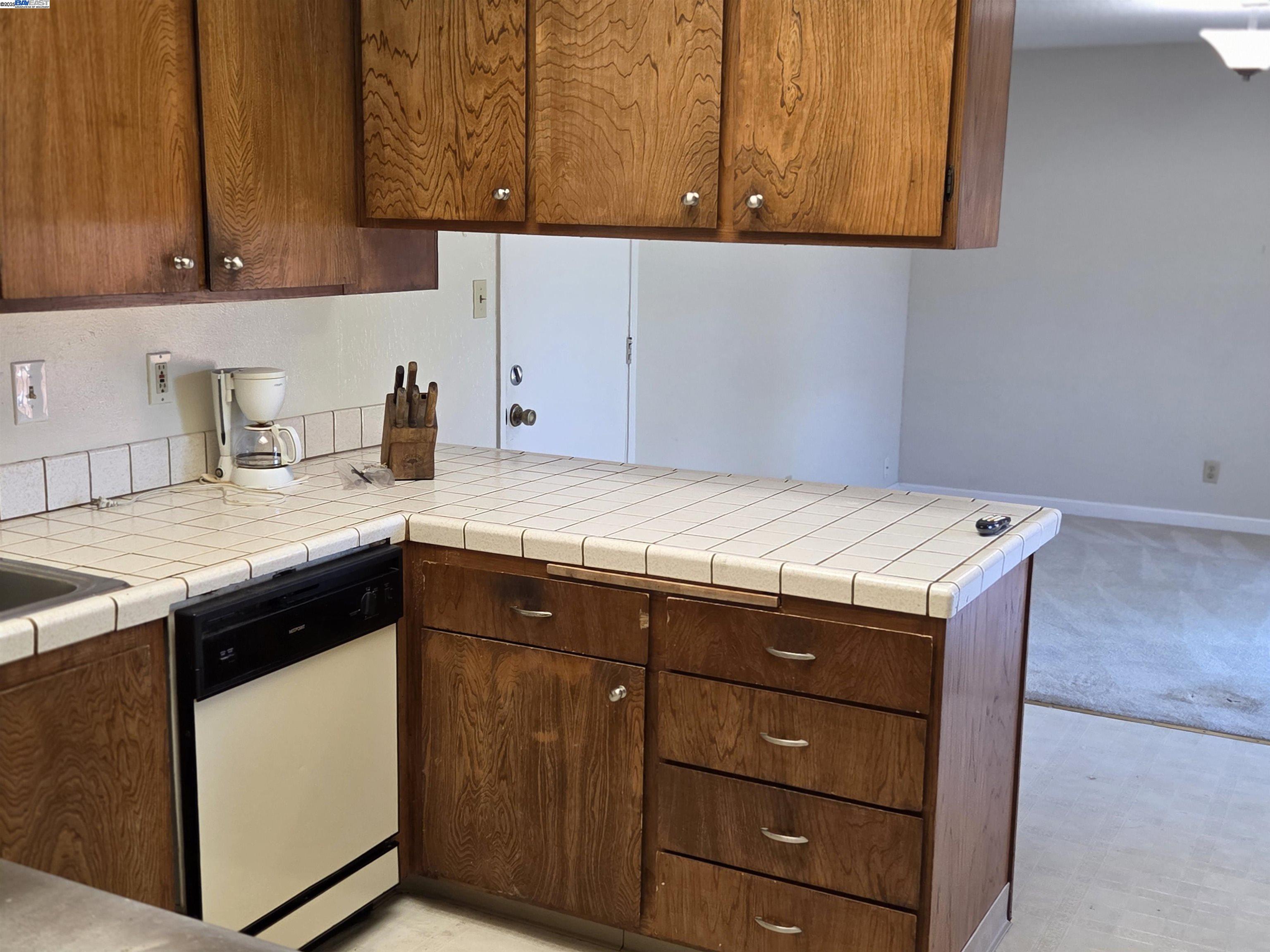 6198 Hancock Avenue San Jose, CA 95123 - Photo 4 of 27 a kitchen with a sink and cabinets