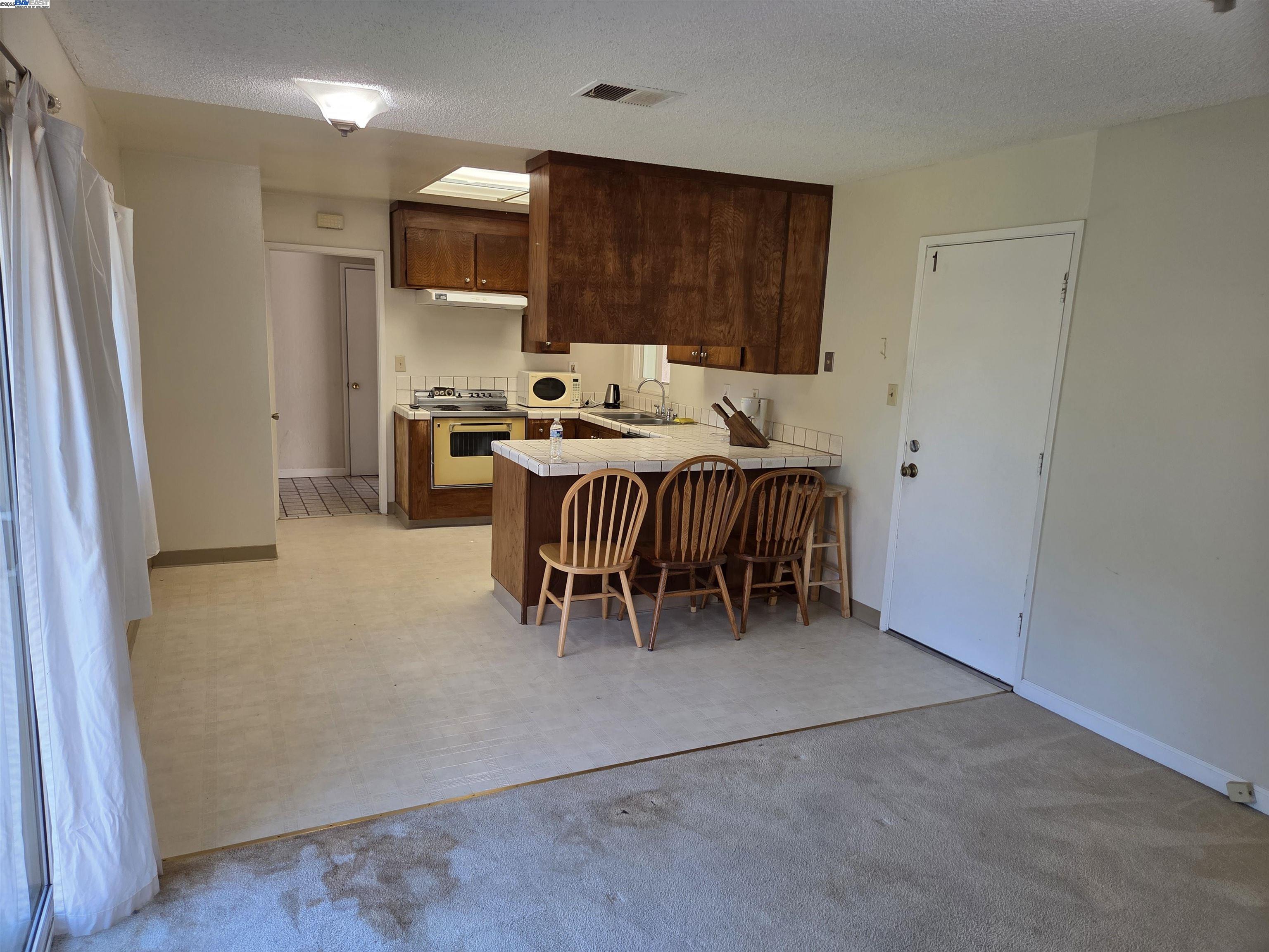 6198 Hancock Avenue San Jose, CA 95123 - Photo 5 of 27 a view of a dining room with furniture and window