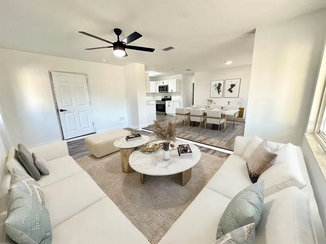 a living room with furniture and a table