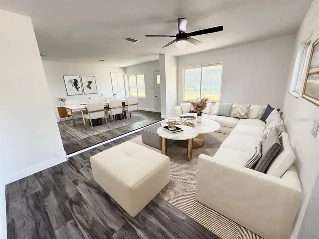 a living room with furniture and window