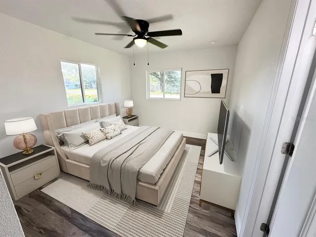 a bedroom with a large bed and a window