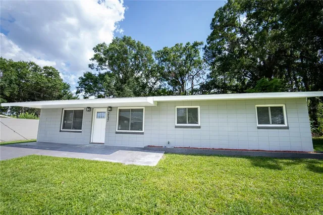 a backyard of a house with seating space
