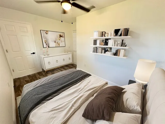 a bedroom with a bed and window