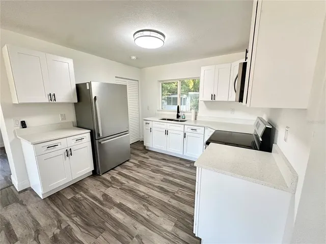 a view of kitchen and washer and dryer
