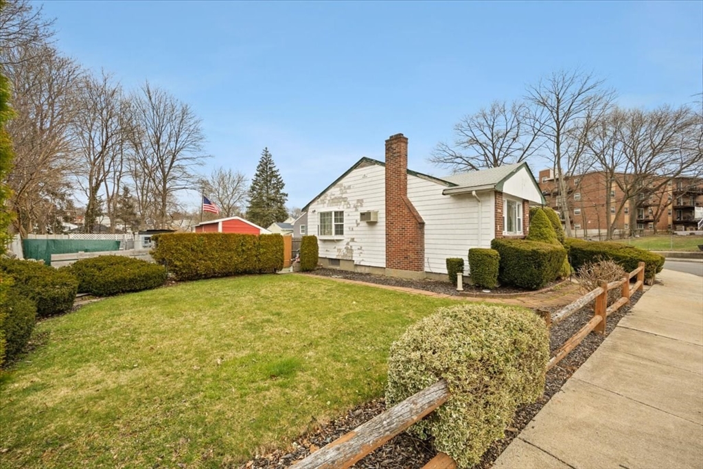 22 Rugdale Road Boston, MA 02124 - Photo 3 of 39 a front view of a house with garden