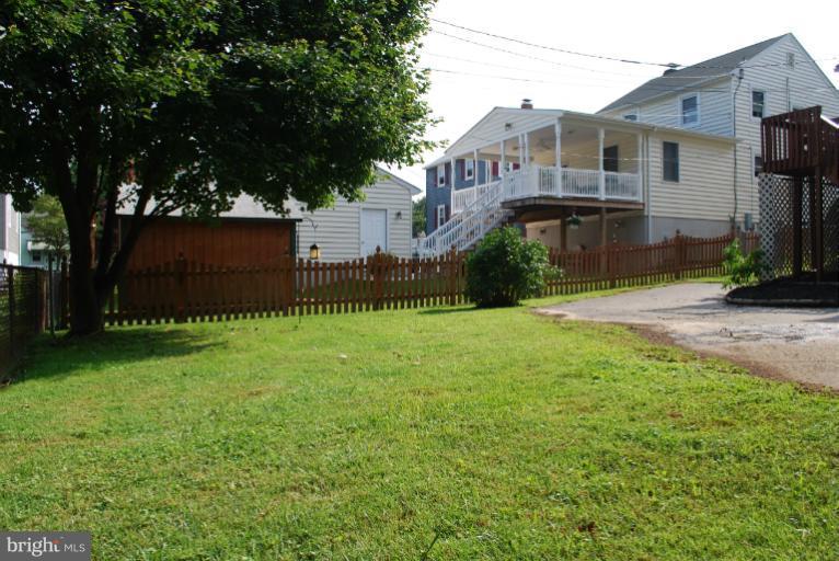 5573 Ashbourne Road Halethorpe, MD 21227 - Photo 22 of 30 a front view of a house with garden
