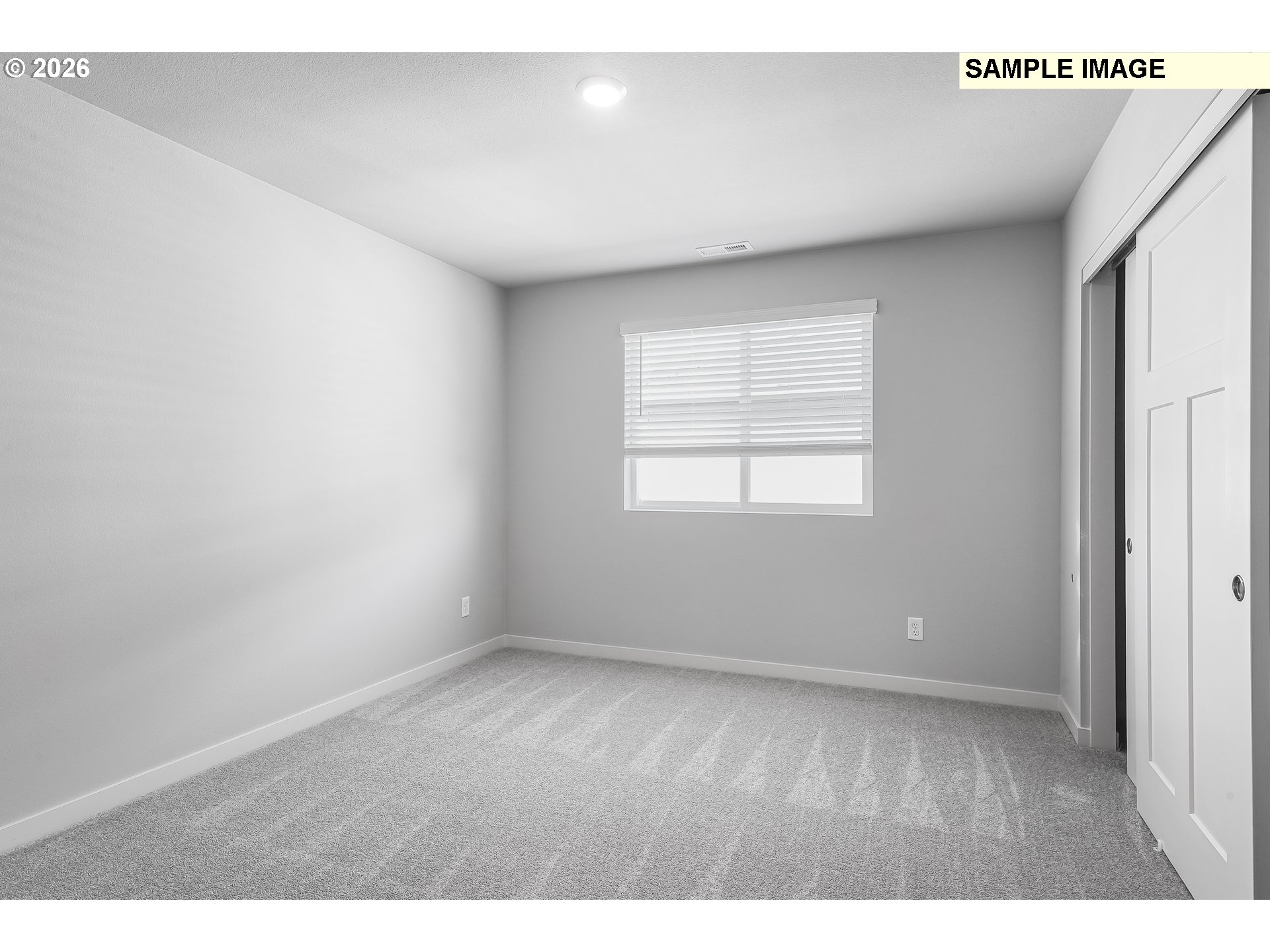 1091 Legacy Street Eugene, OR 97402 - Photo 13 of 18 an empty room with wooden floor and windows