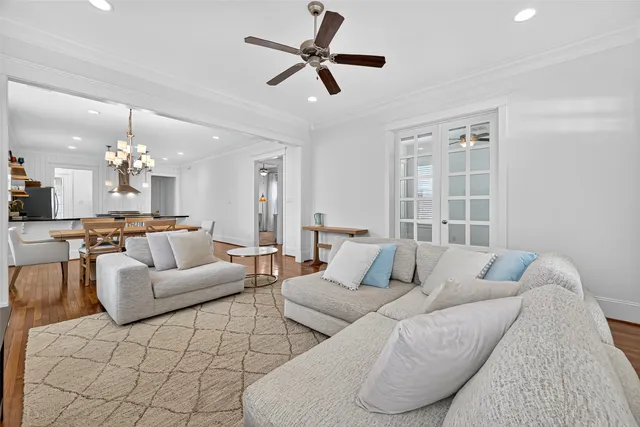 a view of a dining room with furniture wooden floor and chandelier