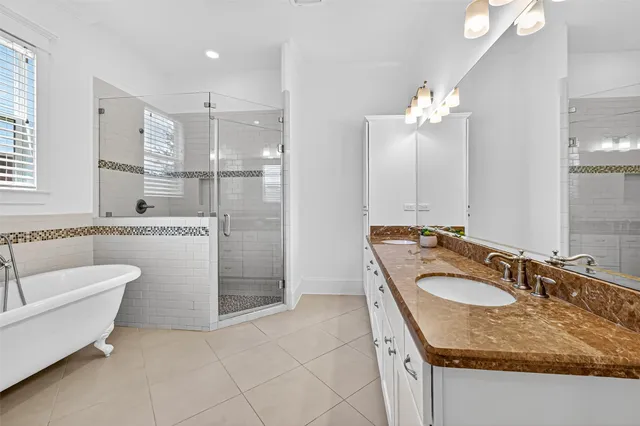 a bathroom with a bathtub and shower