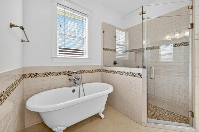 a bathroom with a sink a vanity a shower and a mirror