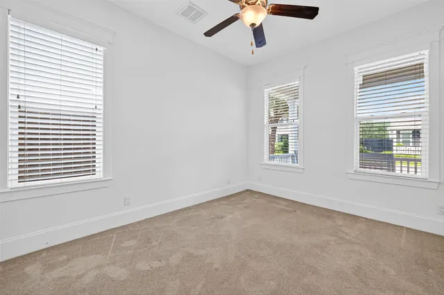a bathroom with a granite countertop sink and a mirror a bathtub