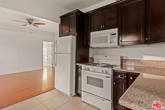 a kitchen with a stove microwave and refrigerator