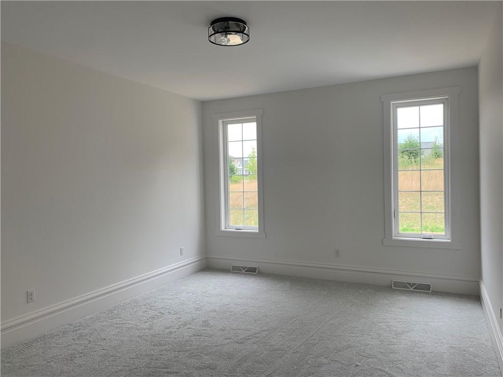 295 Hutchman Road Mars, PA 16046 - Photo 15 of 25 1st floor master! Large enough to fit queen or king sized bed. Beautiful en suite bathroom and large walk-in closet with separate sides.