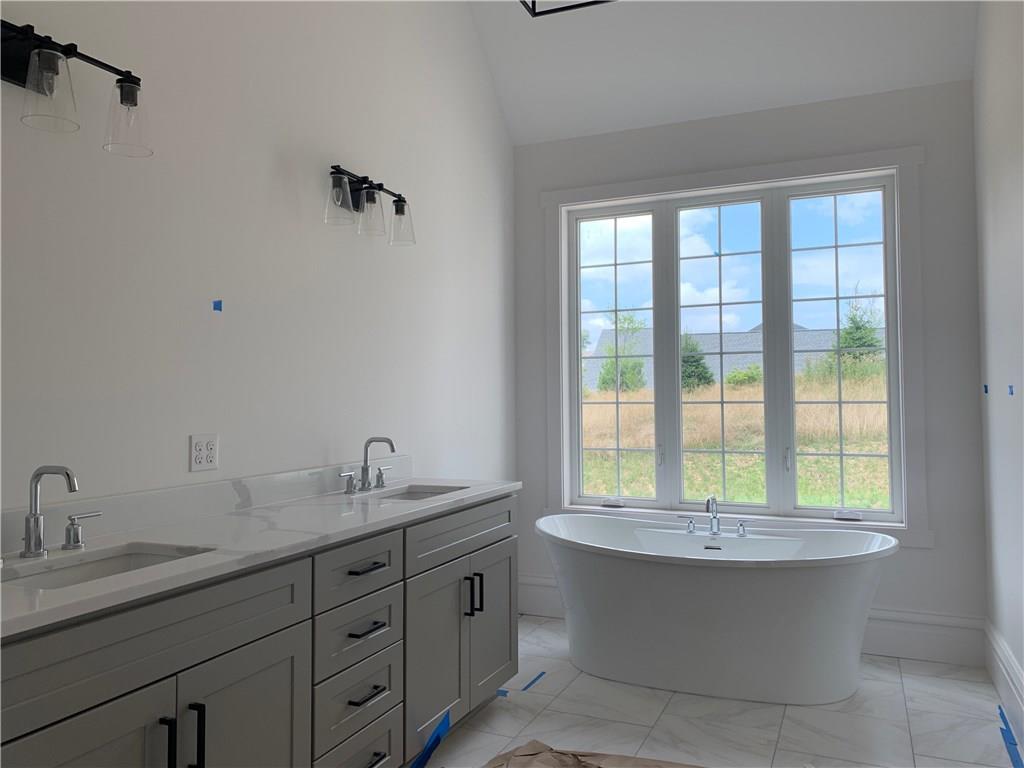 295 Hutchman Road Mars, PA 16046 - Photo 16 of 25 Beautiful master bath features a grey painted double vanity with quartz top, ceramic walk in shower with glass door and free standing bath tub!