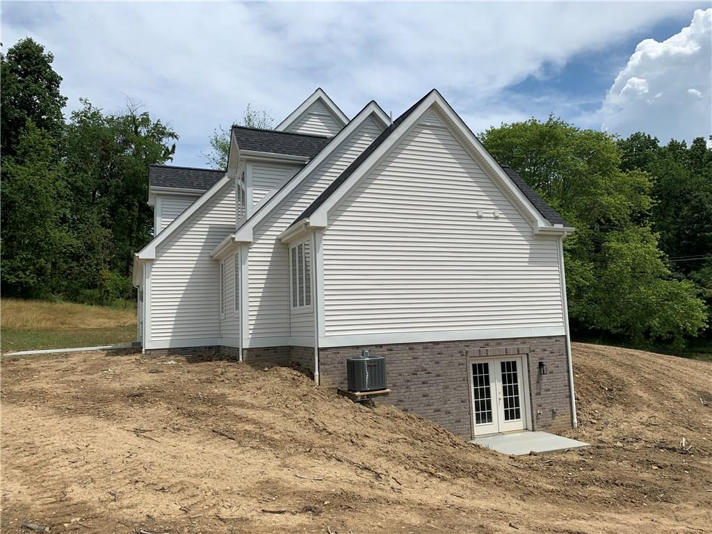 295 Hutchman Road Mars, PA 16046 - Photo 3 of 25 Walkout basement on side of house with glass french doors!