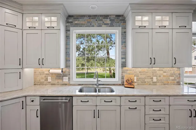 a spacious bedroom with a bed and a flat screen tv