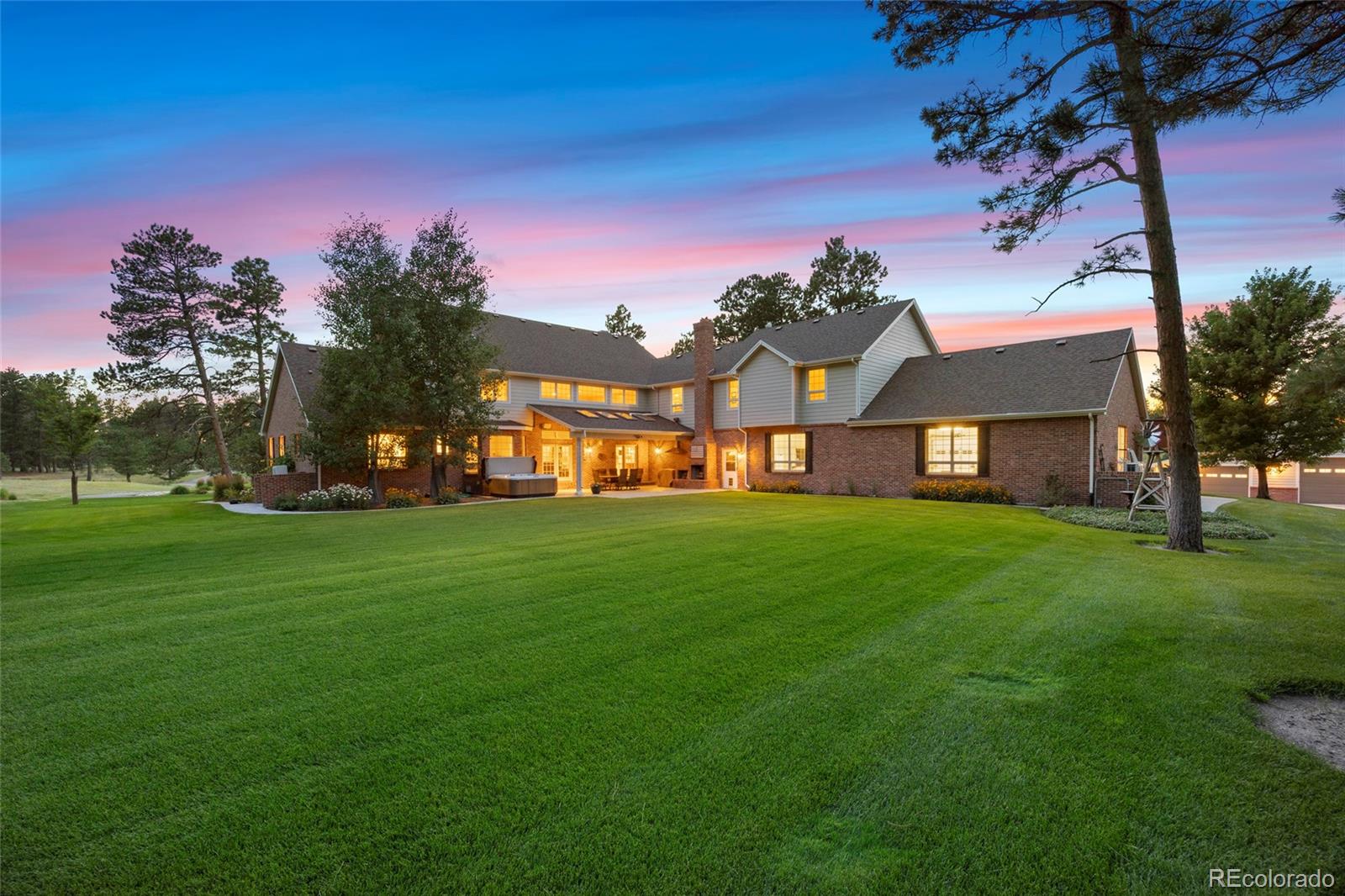 38666 County Road 21 Elizabeth, CO 80107 - Photo 18 of 48 a front view of a house with a yard table and chairs