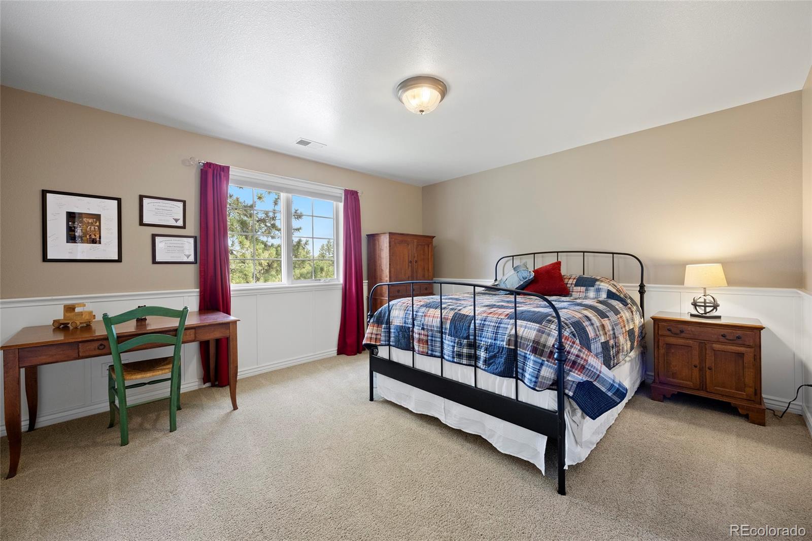 38666 County Road 21 Elizabeth, CO 80107 - Photo 30 of 48 a bedroom with a bed and a lamp next to window