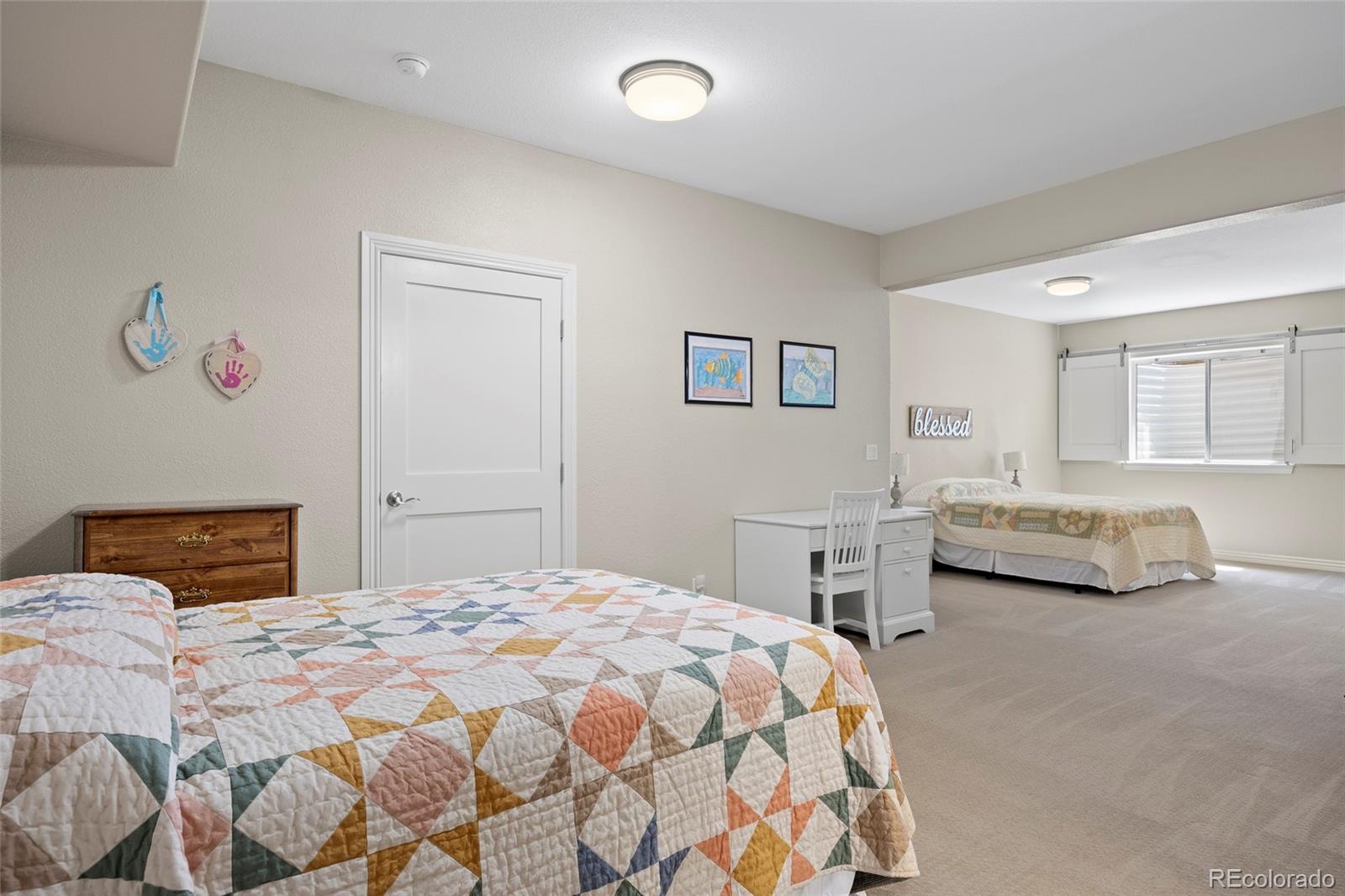 38666 County Road 21 Elizabeth, CO 80107 - Photo 34 of 48 a bedroom with a bed and a chair